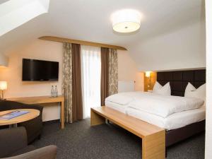 מיטה או מיטות בחדר ב-Hotel Neckartal