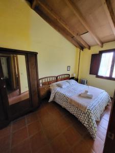 Postel nebo postele na pokoji v ubytování Casa Rural La Severina