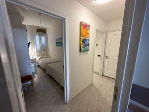 Postel nebo postele na pokoji v ubytování Porto Cesareo Hotel