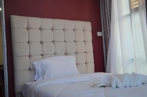 En eller flere senger på et rom på Montana Guest Resort Naivasha