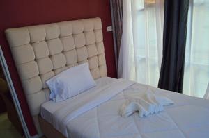 Cama ou camas em um quarto em Montana Guest Resort Naivasha