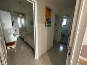 Postel nebo postele na pokoji v ubytování Porto Cesareo Hotel