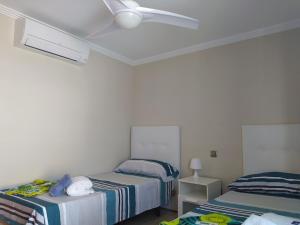 Posteľ alebo postele v izbe v ubytovaní Nuza, Villa con Piscina y Barbacoa