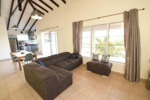 Posezení v ubytování 972D1 - Résidences Tamarin Haut de villa Tamarin 200m2 vue panoramique
