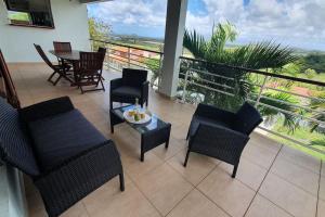 Balkón nebo terasa v ubytování 972D1 - Résidences Tamarin Haut de villa Tamarin 200m2 vue panoramique