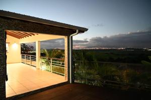 Balkón nebo terasa v ubytování 972D1 - Résidences Tamarin Haut de villa Tamarin 200m2 vue panoramique