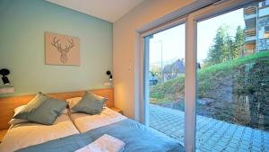 Katil atau katil-katil dalam bilik di Apartamenty EverySky - Słowackiego 5a-b