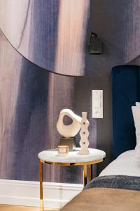 Łóżko lub łóżka w pokoju w obiekcie Dandelion Apartment - LoftAffair