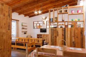 a dining room with a table and wooden walls at Wild Eden Self-Catering Accommodation in Swakopmund