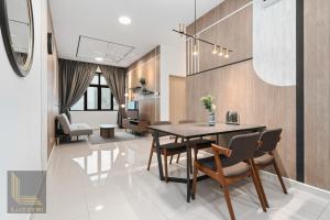 a dining room with a table and chairs at Legasi Kampung Baru Guesthouse in Kuala Lumpur