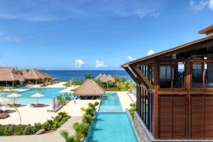 an aerial view of the resort with the ocean in the background at InterContinental Dominica Cabrits Resort & Spa, an IHG Hotel in Portsmouth