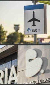 zwei Bilder eines Zeichens vor einem Gebäude in der Unterkunft Central apartment 5min drive to the Airport. in Stockholm