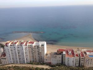 an aerial view of a building and the beach at Piso Alicante in Alicante