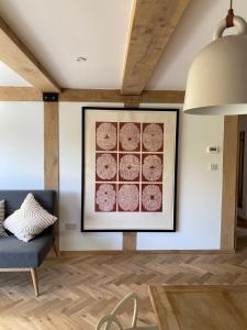 a living room with a picture on the wall at Weavers Rest in Biddenden