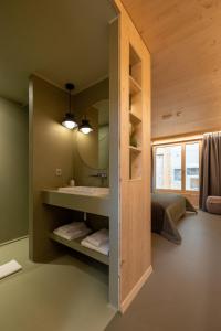Ένα ή περισσότερα κρεβάτια σε δωμάτιο στο MAD Mount Hotel & Spa