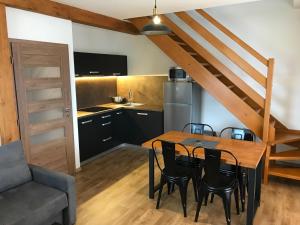 Kuchyňa alebo kuchynka v ubytovaní Horské apartmány Na Pastvinách