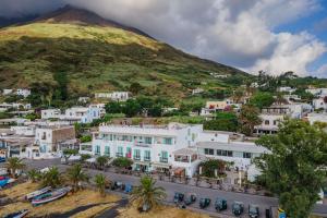 a view of a town with a mountain in the background at Hotel Ossidiana Stromboli Center in Stromboli