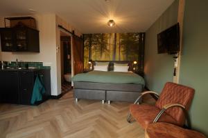 Postel nebo postele na pokoji v ubytování B&B 't Speulderbos