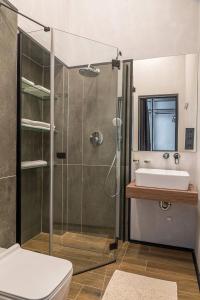 a bathroom with a shower and a sink at Sherwood Chalet in Bukovel +26 photos