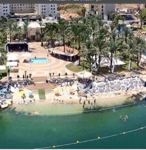 an aerial view of a resort with a swimming pool at On the magic Lake in Tiberias