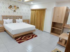 Posteľ alebo postele v izbe v ubytovaní Hotel Lotus