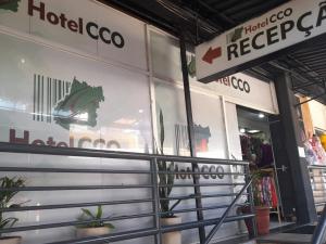 a store front with a sign on the window at Hotel Cco Goiânia in Goiânia