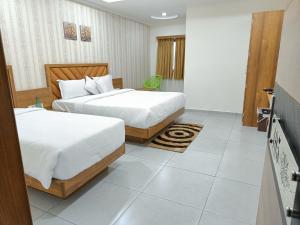 Posteľ alebo postele v izbe v ubytovaní Hotel Lotus