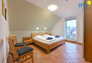 Postel nebo postele na pokoji v ubytování Maisonette-Wohnungen am Steingarten - Ferienwohnung 2