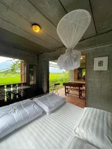 a bedroom with a large bed with a ceiling at 467 Chiang Dao in Chiang Dao