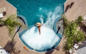 an overhead view of a pool with a man in the water at Tzante Hotel Zakynthos, Adults Only in Laganas