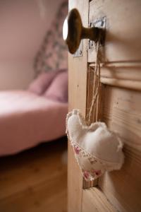 a bedroom with a door open with a bed at Le Parc du Magnolia in Montbéliard