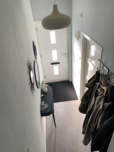 a room with a hallway with a door and a light at B&B Vintage Room in Vught