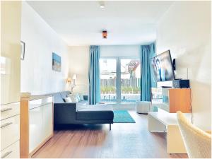 Televiisor ja/või meelelahutuskeskus majutusasutuses Apartments Boardinghaus Norderney