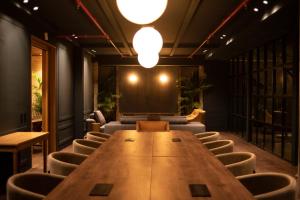 a conference room with a long table and chairs at Hotel Coco in Bogotá