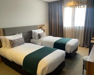 Postel nebo postele na pokoji v ubytování Urban Hotel & Spa