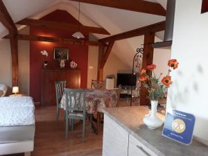 a living room with a table and a dining room at Apartament Tina in Dzierżoniów