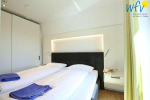 Ένα ή περισσότερα κρεβάτια σε δωμάτιο στο Villa Drees Ferienwohnung 8