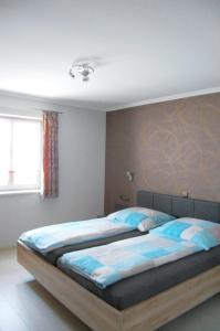 Postel nebo postele na pokoji v ubytování Ferienwohnung & App. Rosemarie