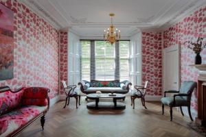 a living room with a couch and a table at The Scott in Edinburgh