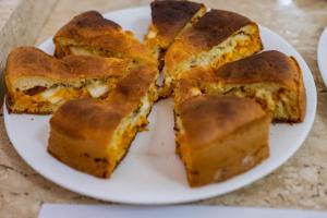 a plate of food with slices of bread on it at Pousada Paraiso in Guanambi
