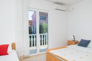 Postel nebo postele na pokoji v ubytování Apartment Mijo