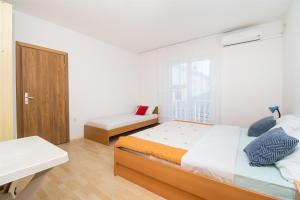 Postel nebo postele na pokoji v ubytování Apartment Mijo
