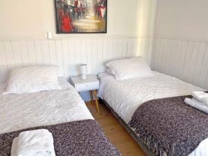 Gulta vai gultas numurā naktsmītnē Novaqua Bed & Breakfast