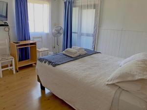 Gulta vai gultas numurā naktsmītnē Novaqua Bed & Breakfast