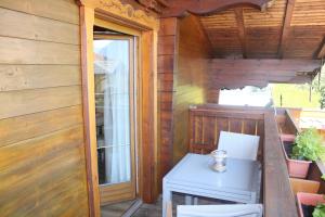 a small porch with a table and a stove at Landhaus Johanna in Dorfgastein