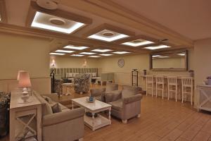 a large living room with couches and a table at Hotel Real Intercontinental Guatemala, an IHG Hotel in Guatemala