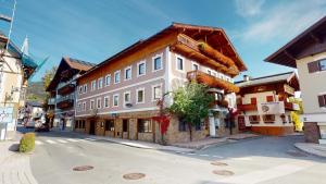 a building on the side of a street at Hotel Daxer in Kirchberg in Tirol