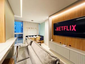 a hotel lobby with a netflix sign on the wall at ITAPARICA SALINAS EXCLUSIVE in Vila Velha