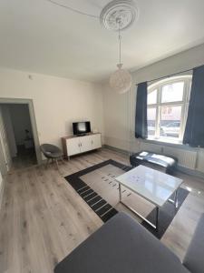 a living room with a couch and a table at Finlandsgade 41 st (id.054) in Esbjerg