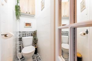 a bathroom with a toilet and two sinks at Old Town Vintage Apartment Sturova in Košice